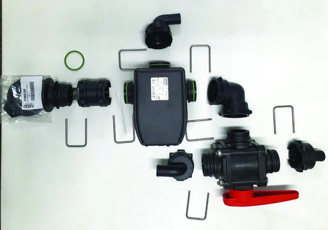 Valve kit parts laid out before assembly: dump valve, 3-way ball valve, elbows, hose tails and clips